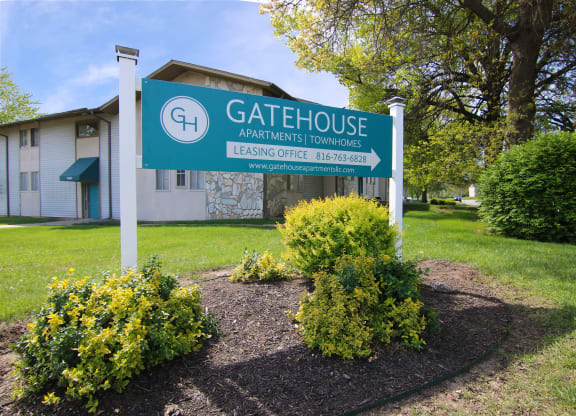 the gatehouse apartments sign in front of a building at Gatehouse Apartments, Kansas City, MO, 64134