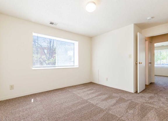 an empty room with a window and a door at Waldo Heights, Kansas City