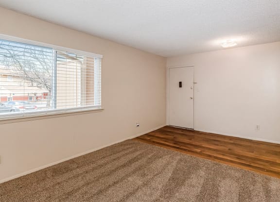 East One Bedroom Living Room and Entry at Raintree Apartments, Topeka, KS