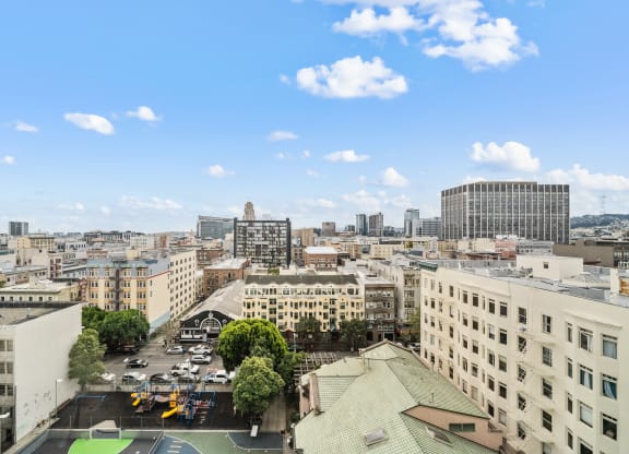 the view of the city from the roof of a building