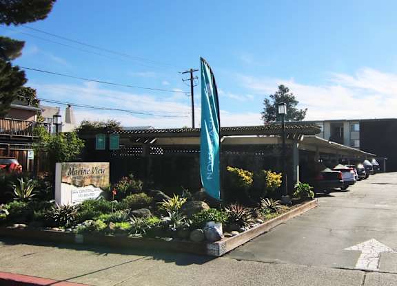 A sign for Marine View Plaza is visible in front of a building.
