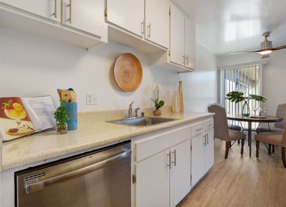 Kitchen Sink, Dishwasher, and Dining Room at Three Crown Apartments, Alameda, CA, California, 94501