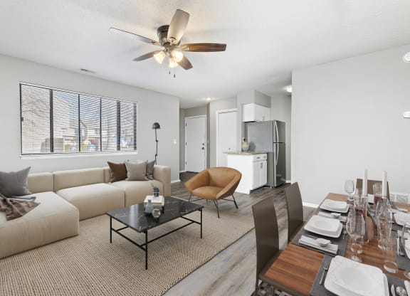 Living room and dining room view with furniture at Eddingham in Lawrence, KS