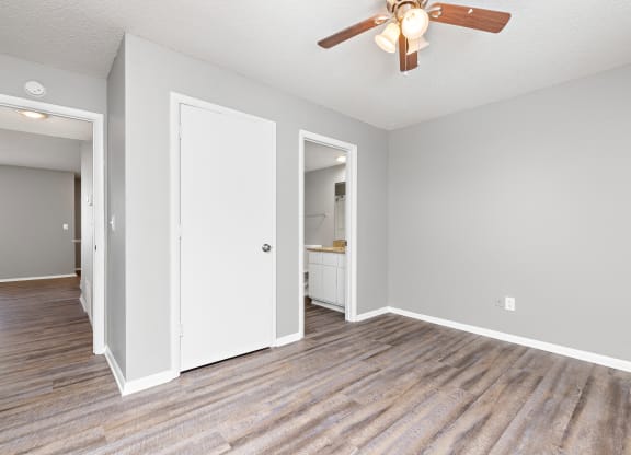 Bedroom with closet door and bedroom door at Eddingham in Lawrence, KS