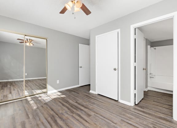Bedroom with closet doors at Eddingham in Lawrence, KS