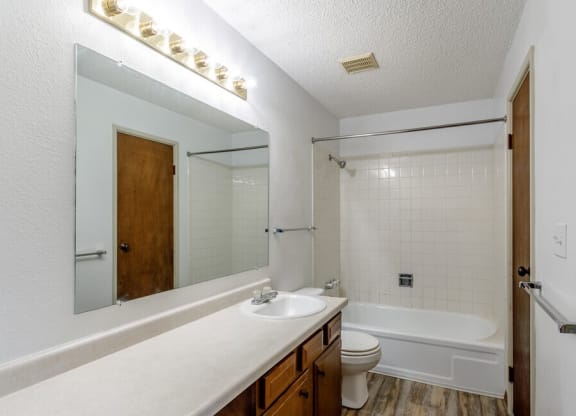 a bathroom with a sink toilet and bathtub