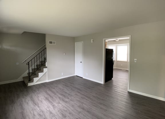 Spacious living room looking into kitchen