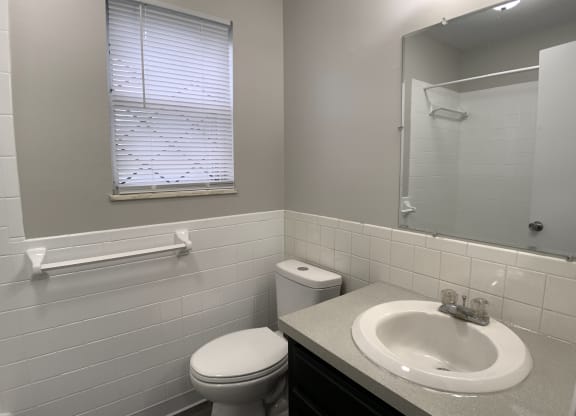 Bathroom with sink and toilet at Roosevelt in Independence, MO