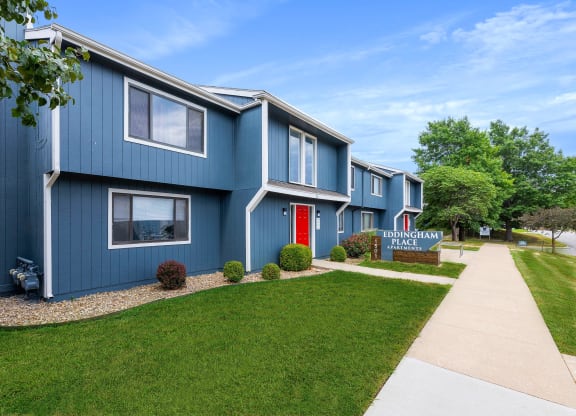 a blue building with a red door