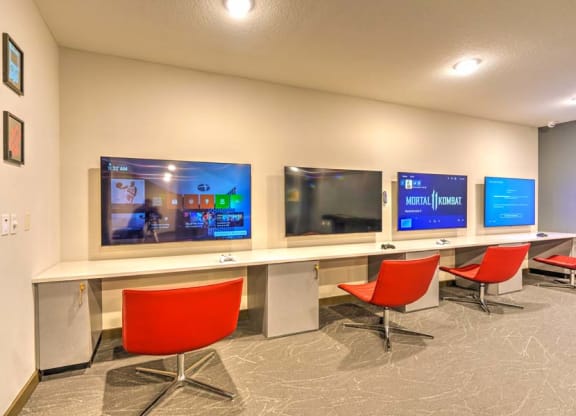 a room with three televisions on the wall  at Fusion, Jacksonville, FL, 32256