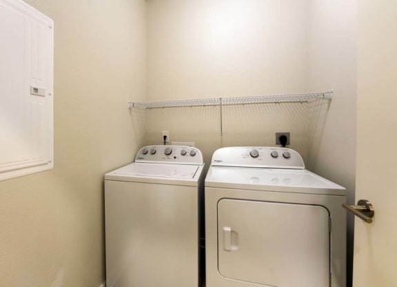 a washer and dryer in a room  at Fusion, Jacksonville, 32256