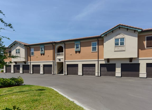 a building with a parking lot in front of it  at Hacienda Club, Florida