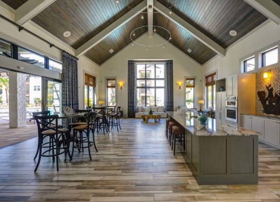a kitchen with a long counter and a window  at Cabana Club - Galleria Club, Jacksonville, FL