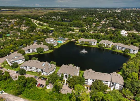an aerial view of a lakeside community with a sailboat in the lake  at Ocean Park, Jacksonville Beach, 32250