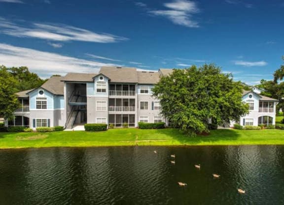 a building with a large pond in front of it  at Ocean Park, Florida, 32250
