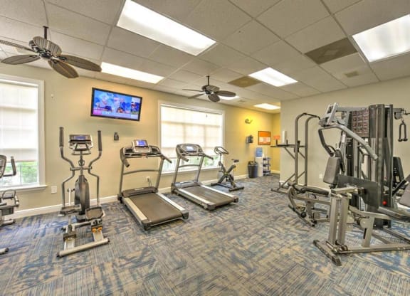 our apartments showcase a gym with equipment and a flat screen tv  at Ocean Park, Jacksonville Beach, 32250