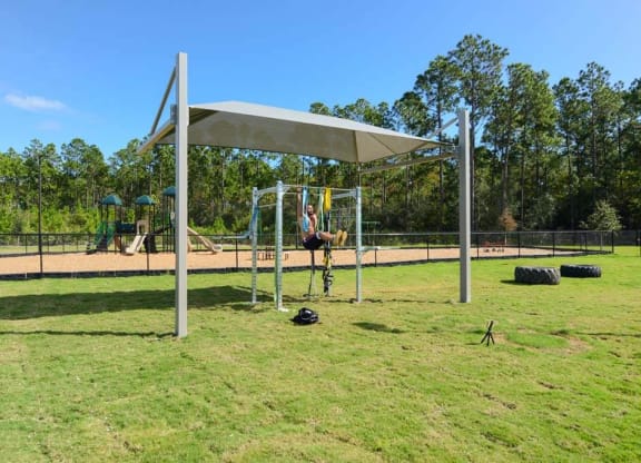 a person on a swing set in a park  at Luxor Club, Jacksonville