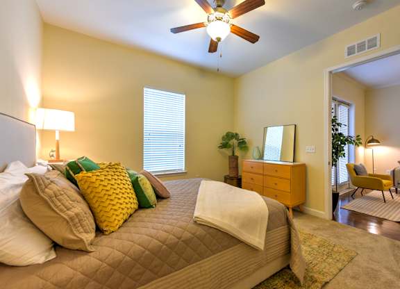 A bedroom with a bed, dresser, and chair at Alaqua, Florida, 32258