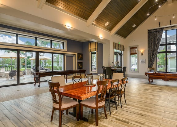 a large gathering room with a pool table and ping pong table  at Cabana Club - Galleria Club, Jacksonville, FL