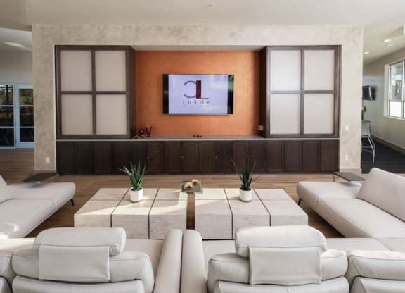a living room filled with furniture and a flat screen tv  at Luxor Club, Florida, 32258