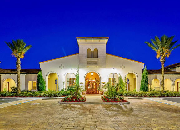 a house with a driveway and palm trees in front of it  at Hacienda Club, Jacksonville, FL, 32256