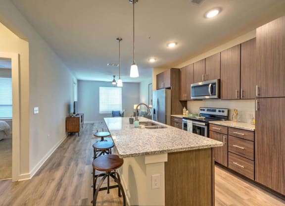 a kitchen with a counter top next to a stove top oven  at Luxor Club, Florida