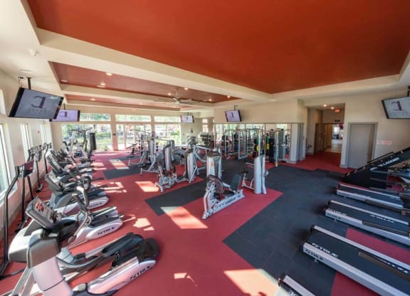 a room filled with lots of different types of exercise equipment  at Luxor Club, Jacksonville, 32258