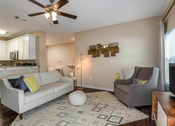 a living room with a couch and a chair  at Ocean Park, Florida, 32250