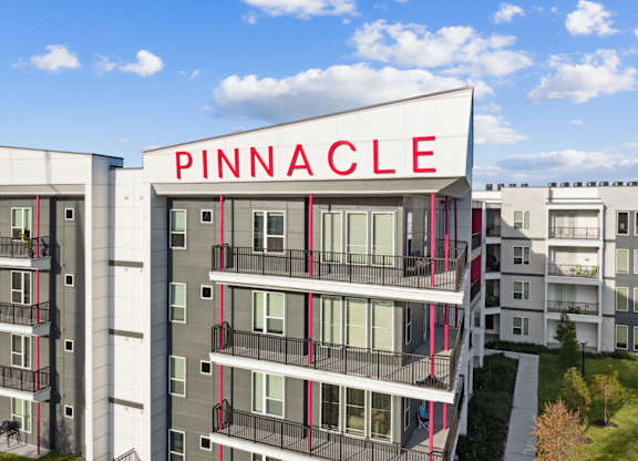 A modern apartment building named Pinnacle is shown in the imageat Pinnacle Apartments, Jacksonville, FL