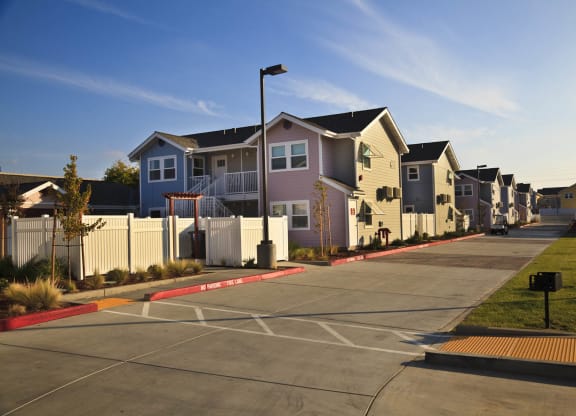 Mutual Housing at the Highlands units, driveway, barbecue