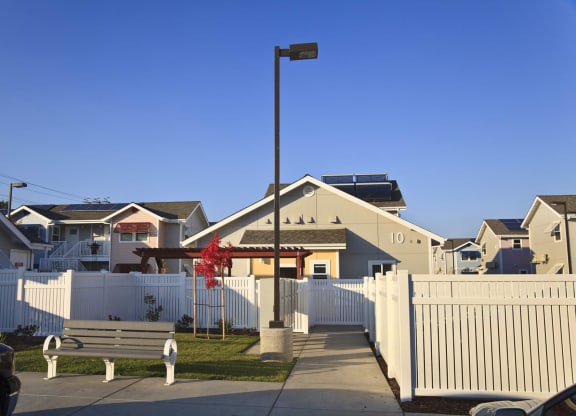Mutual Housing at the Highlands units, park bench, fence