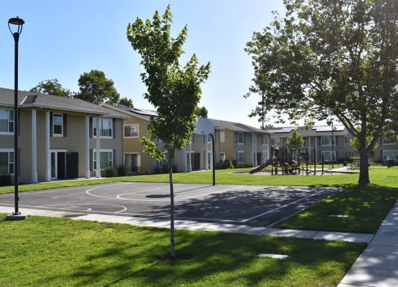 Mutual Housing on the Greenway basketball court and unit exterior