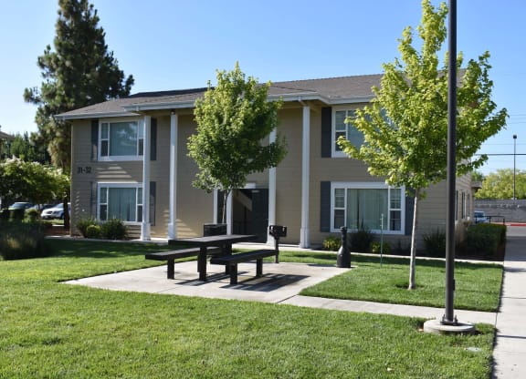 Mutual Housing on the Greenway barbecue area and unit exterior