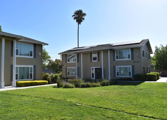 Mutual Housing on the Greenway lawn and multiple building unit exterior