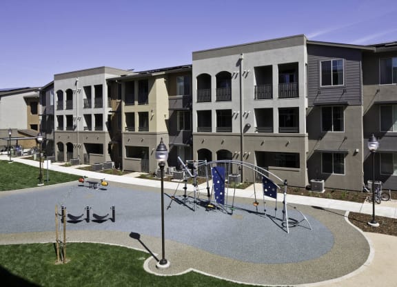 New Harmony Mutual Housing Community unit exterior and playground photographed from elevated point