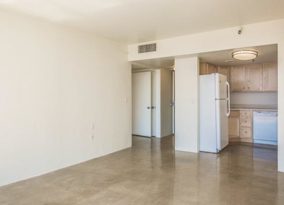 A spacious kitchen with white appliances and cabinets at Herbert Residential, Tucson, AZ 85701