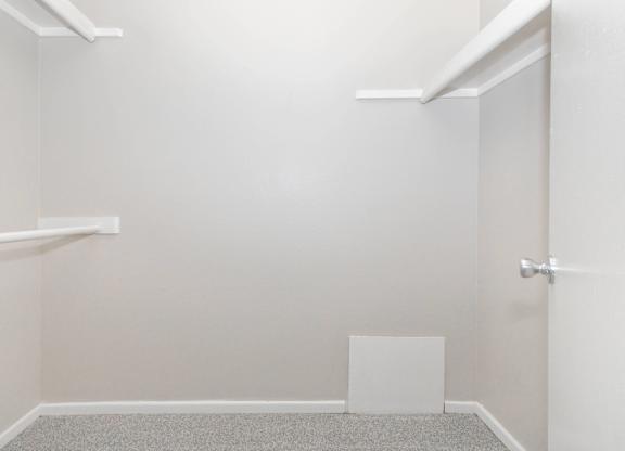 A white door is on the right side of a room.