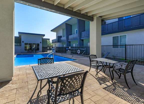 The Hedrick on Mountain Townhome-Style Apartments in Tucson, Arizona Pool with Lounge Chairs