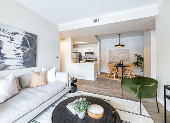 a living room with a couch a table and a chair