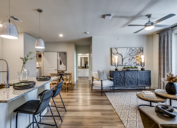 a living room with a kitchen and a dining room