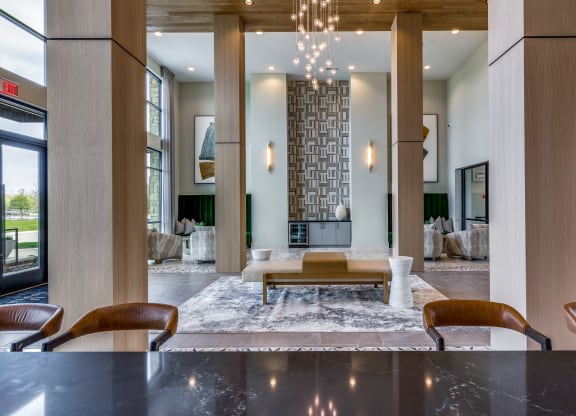 a living room with a fireplace and a table and chairs