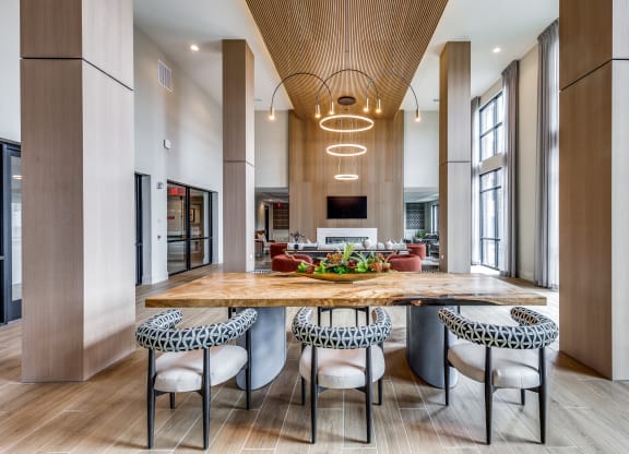 a large kitchen with a wooden table and chairs