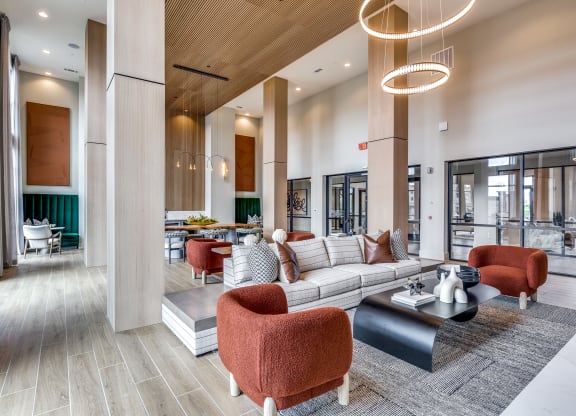 a large lobby with couches and chairs and a table