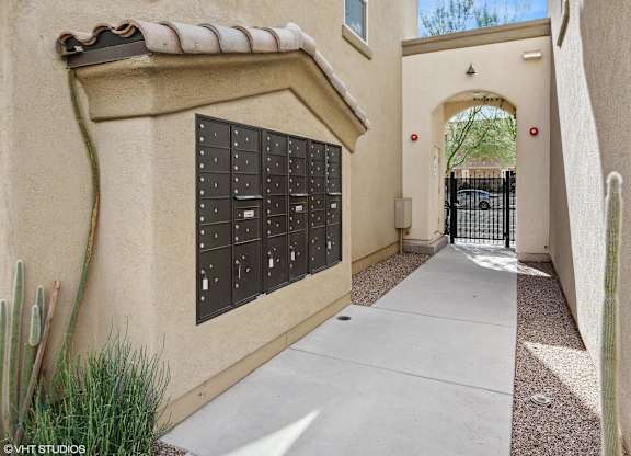A wall with mailboxes on it.