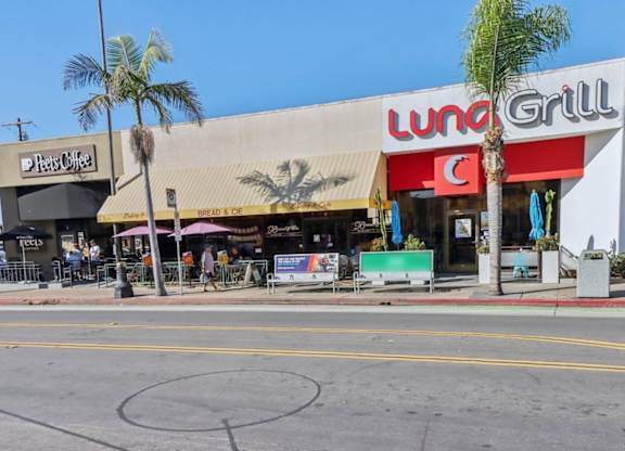 A street view of a Lunch Grill restaurant with a Peet's Coffee shop next to it.