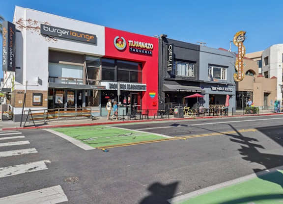 A street view of a Burger Lounge and a Tijuana restaurant.
