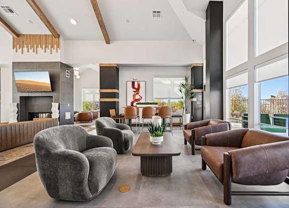 A modern living room with grey and brown furniture.