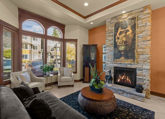 a living room with a fireplace and a couch