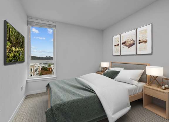 A bedroom with a large bed and a window overlooking a cityscape.