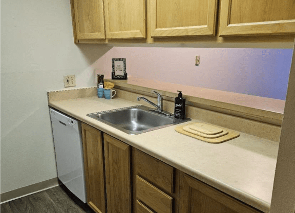 Ventana Apartment kitchen with brown cabinets